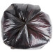 A black plastic bag with a twisted top.