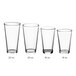 A row of clear Acopa mixing glasses with measurements on a white background.