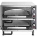 A silver rectangular Waring countertop double pizza oven with knobs and controls.