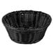 A black round rattan basket with a handle.