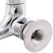 A chrome wall-mounted Equip by T&S faucet with lever handles.