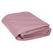 A folded pink Intedge 100% polyester table cover on a white background.