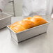 A loaf of bread in a Chicago Metallic aluminized steel bread loaf pan.