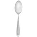 A silver Walco Mastaba serving spoon with a white handle.
