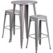 A Flash Furniture silver metal bar height table with 2 square seat backless stools.