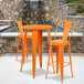 Flash Furniture CH-51080BH-2-30CAFE-OR-GG 24" Round Orange Metal Indoor / Outdoor Bar Height Table with 2 Cafe Stools Main Thumbnail 1