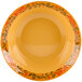 A yellow Venetian bowl with a floral design.