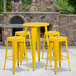 A Flash Furniture yellow metal bar height table with 4 square yellow metal backless stools.