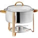 A stainless steel round soup chafer with gold accents.