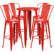 A Flash Furniture red metal bar table with four red stools.