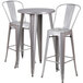 A Flash Furniture metal bar table with a silver surface and two chairs with backrests.