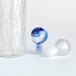 An American Metalcraft glass bottle stopper with a blue and white marble sphere.