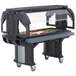A black Cambro Versa food and salad bar on heavy-duty casters with food on it.