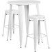 A white Flash Furniture bar height table with two square stools.