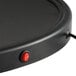 A round black LED oval pizza sign with a red button.