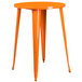 A Flash Furniture orange metal bar height table with legs.