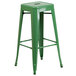 A green metal square seat backless stool.