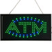 A rectangular black LED ATM sign with blue and green lights.