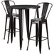 A Flash Furniture 3 piece black metal bar set with 30" round table and 2 black metal bar stools.