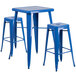 A blue metal square table with three blue metal square stools.