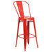A Flash Furniture red metal bar height table with 4 red metal bar stools.