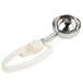 A Zeroll #10 ivory ice cream scoop with a metal spoon and white handle.