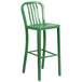 A Flash Furniture green metal bar stool with a seat.