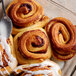 A cinnamon roll made with Bob's Red Mill Gluten-Free Baking Flour on a baking sheet.