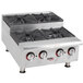 An APW Wyott stainless steel countertop range with four square burners.