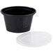 A black Newspring oval souffle container with a clear plastic lid.