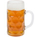 A Stolzle glass beer mug with foamy beer in it.