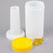 A white plastic container with a yellow lid and cap.