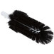 A white handle with a black round brush with long bristles.