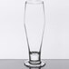 A customizable Libbey footed pilsner glass with a clear base.