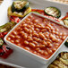A white square bowl of Furmano's vegetarian baked beans and vegetables.