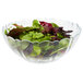 An Arcoroc glass bowl filled with salad greens.