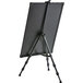 A black easel with a black LED write-on board on it.