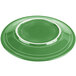 A green Fiesta dinner plate with a white rim.
