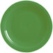 A close-up of a green Fiesta® Dinnerware chop plate with a white background.