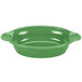 A green oval casserole dish with a white interior and handles.