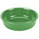 A green Fiesta china bowl with a white circle on a white background.
