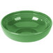 A green bowl with a ripple on the rim.
