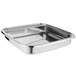 A Vollrath stainless steel rectangular food pan on a counter.