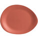 A red Libbey Driftstone melamine platter with a clay surface and organic edge.