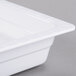 A close-up of a white melamine food pan.