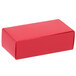 A red rectangular 1/2 lb. candy box with a black lid.