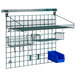 A Metro SmartWall G3 Metroseal 3 task station with blue baskets and containers on a shelf.