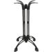 A black cast iron Art Marble Furniture bar height table base with four legs.