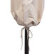 A beige California Umbrella cover on a pole.