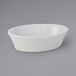Tuxton BPK-100 10 oz. Porcelain White Oval China Baker / Casserole Dish - 12/Case Main Thumbnail 1
